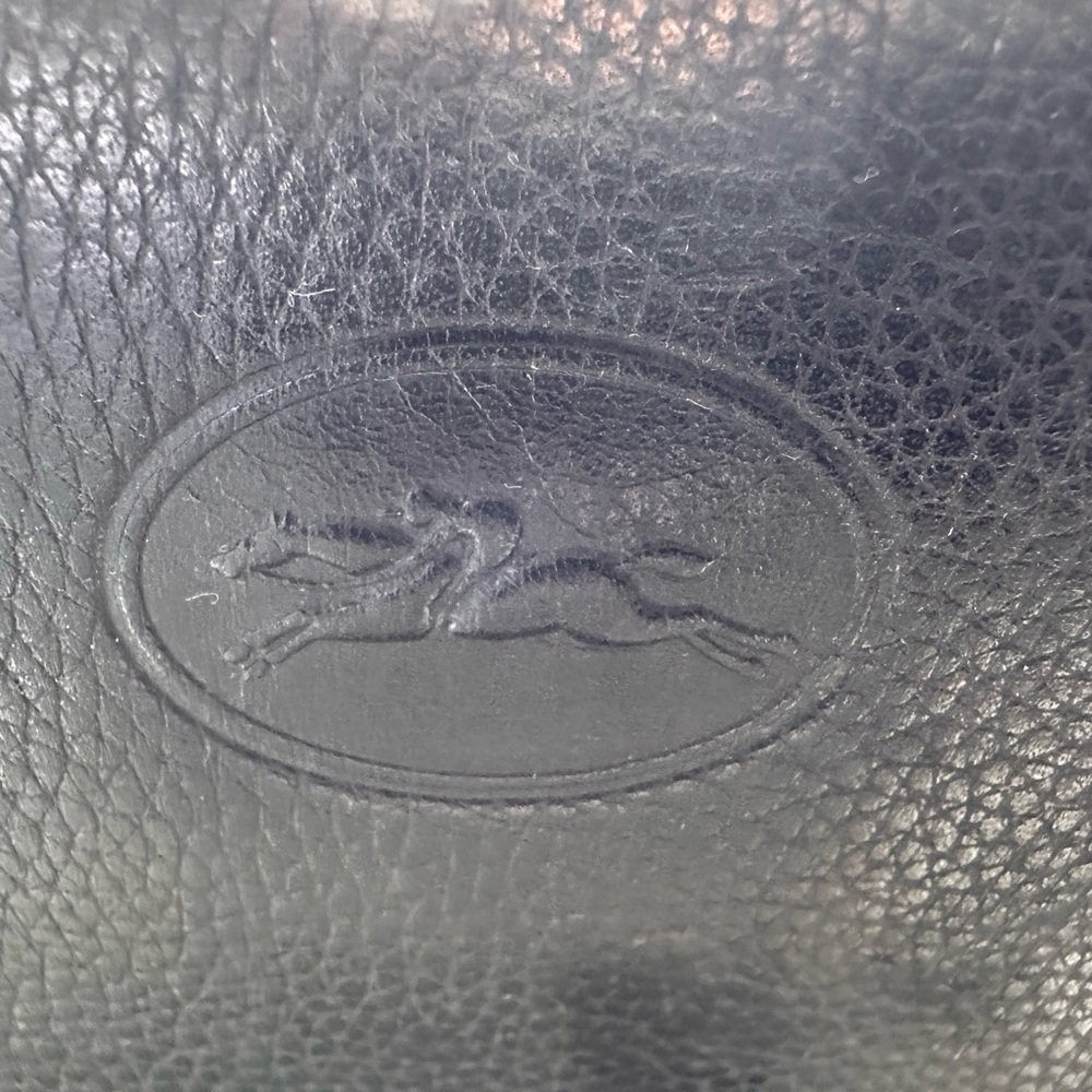 Authentic black leather Longchamp bag used condition.